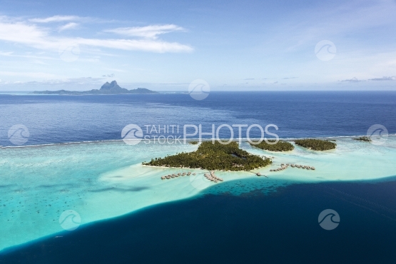 Raiatea, aerial view of the lagoon and Bora Bora in the background