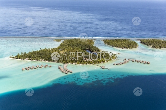 Tahaa, aerial view of a luxurious hotel and overwater bungalows in the lagoon