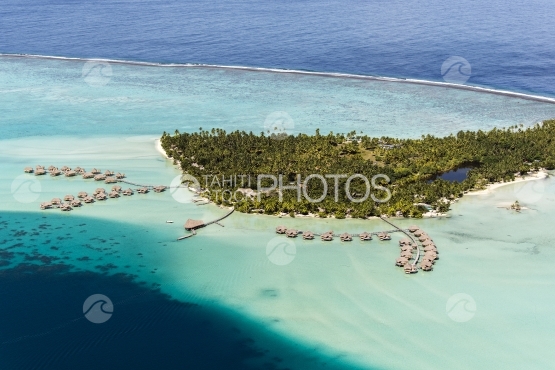 Tahaa, aerial view of a luxury hotel and overwater bungalows in the lagoon