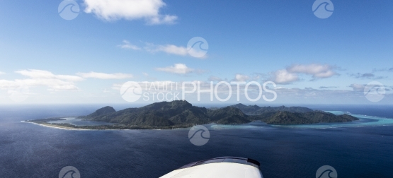 Panoramic aerial view of Huahine, over the plane wing