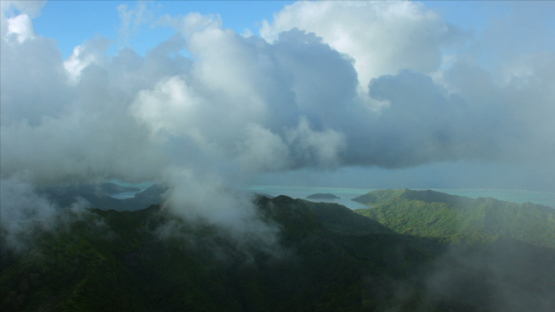 Tahaa, aerial view of the the island under the clouds