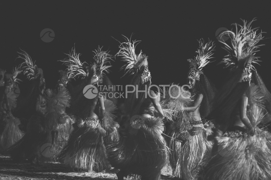 Tahitian women group dancing with traditional costumes