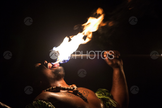 Bora Bora, polynesian dancer putting the flame on his tongue
