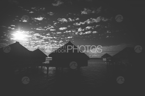 Luxury overwater bungalow in the lagoon of Bora Bora, during sunset