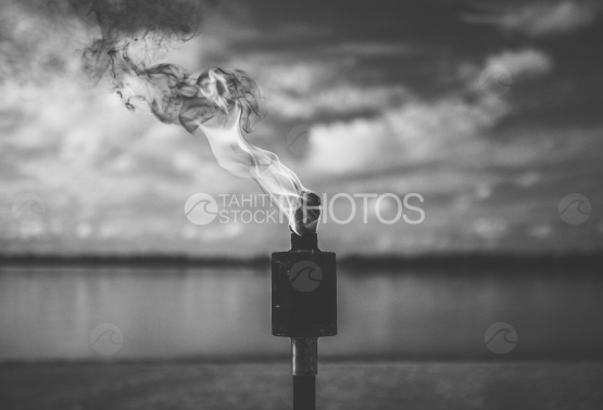Bora Bora, Flame of a torch, on the beach
