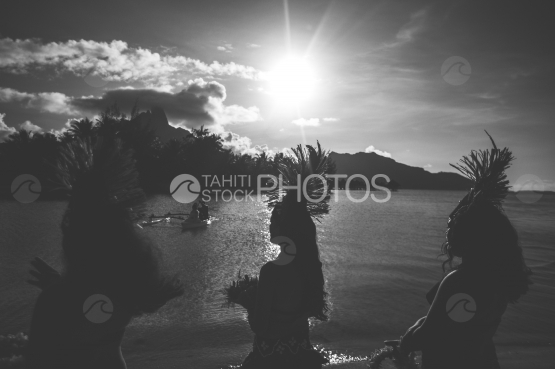 Troup of dancers on the beach at sunset, Bora Bora