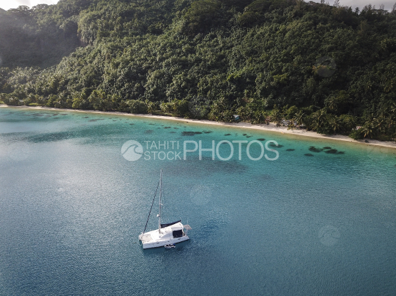 Tahiti, aerial shot of a sail boat in the lagoon