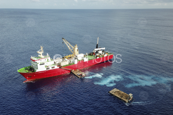 Red Cargo ship in the ocean