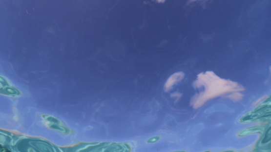 Moorea, the surface of the lagoon, and the sky by transparency