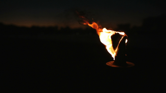 Bora Bora, flame on torch burning on the beach, slow motion