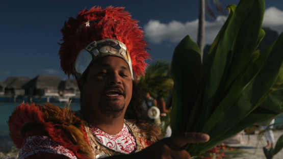 Bora Bora, tahitian priest officiating during traditional wedding, slow motion