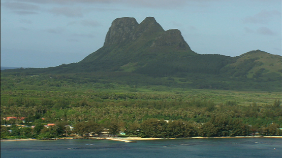 Aerial view of highest point of Tubuai, Austral islands, shot from the lagoon
