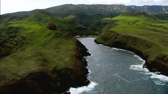 Aerial footage of Ua Huka, Marquesas islands, small bay in the middle of hills