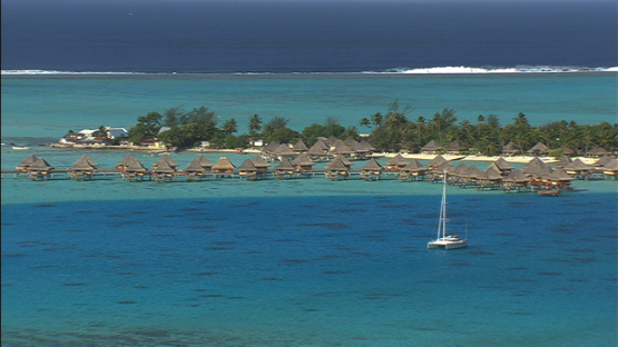 Bora Bora, leeward islands, aerial view of sail boat anchored in front of the hotel in the lagoon