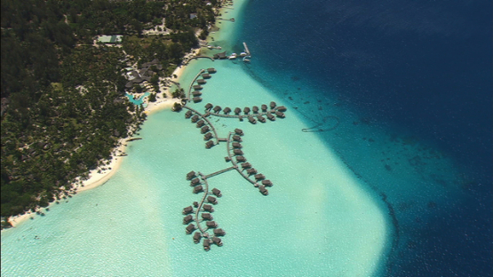 Bora Bora, leeward islands, aerial view of a hotel and overwater bungalows in the lagoon