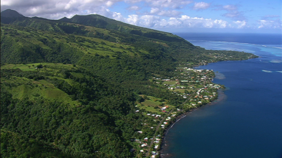 Tahiti, aerial view of the village beside the lagoon, windward islands