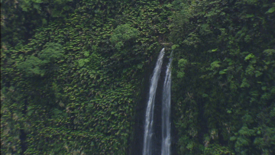 Tahiti, aerial view of the waterfall in the deep valley, windward islands