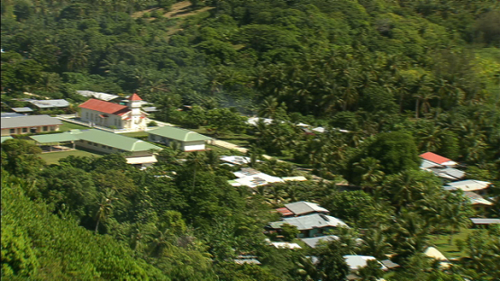 Maiao, aerial view of the village behind the hill, windward islands