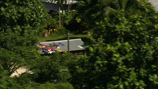Laundry drying under the sun, village of Maiao, aerial view, windward islands