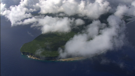 Aerial view of Makatea under clouds, tuamotu archipelago