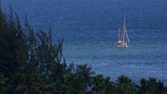 Aerial view of a sailing boat in Valley Hakahui, Nuku Hiva, Marquesas islands