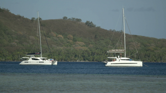 Sail boast anchored in the lagoon, Bora Bora, windward islands
