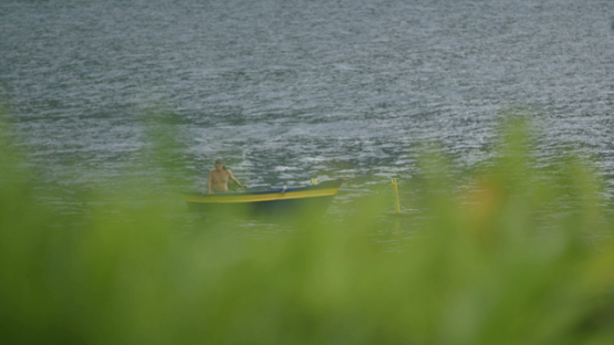 Man on his motorized Outrigger canoe, tahuata, marquesas islands