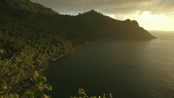 Sunset by the shore with tropical vegetation, Tahuata Marquesas islands