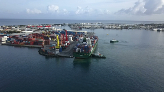 Tahiti,  aerial video drone of cargo ship in the harbour of Papeete