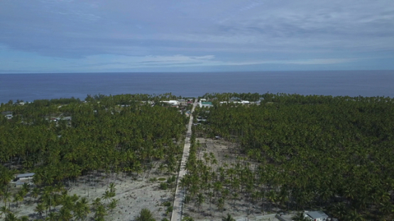 Reao, aerial drone shot  of the village and ocean, Tuamotu Polynesia, 4K UHD