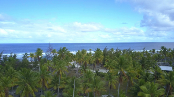 Reao, aerial drone view of the island and ocean, Tuamotu, Polynesia, 4K UHD
