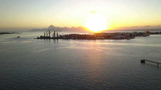 Tahiti, aerial video by drone of sunset in the harbour of Papeete, Polynesia
