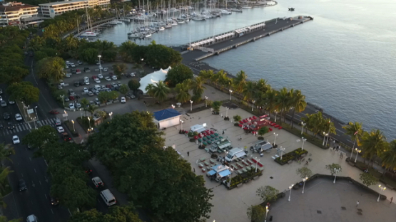 Aerial video by drone of place Vaiete and foodtrucks in Papeete and harbour, Tahiti, Polynesia