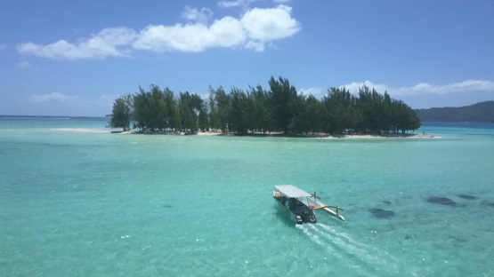 Bora Bora, aerial drone video, outrigger boat in the lagoon,  leeward islands, Polynesia