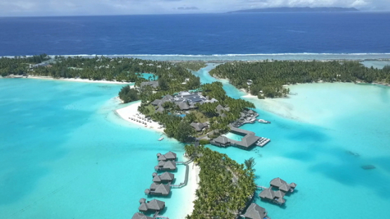 Bora Bora, aerial drone video of luxury overwater hotel in the lagoon, leeward island, polynesia