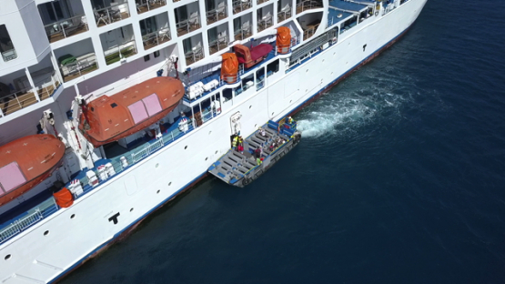 Bora Bora, aerial drone video of cruise ship moored in the lagoon, leeward island, polynesia 4K UHD