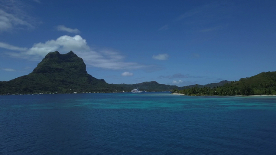 Bora Bora, aerial drone video of otemanu mountain and cruise ship moored in the lagoon, leeward island, polynesia 4K UHD