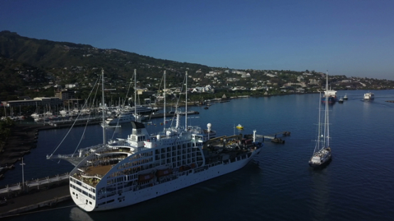 Papeete harbour, aerial drone video of cruise ship in the bay, Tahiti, Polynesia, 4K UHD