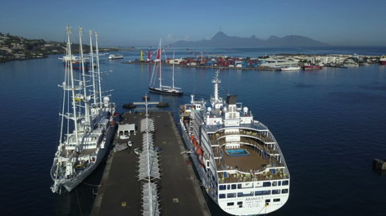 Papeete harbour, aerial drone video of cruise ships moored in the bay, Tahiti, Polynesia, 4K UHD