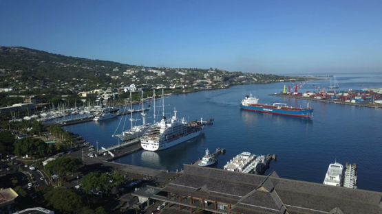 Papeete harbour, aerial drone video of cruise ships and cargo in the bay, Tahiti, Polynesia, 4K UHD