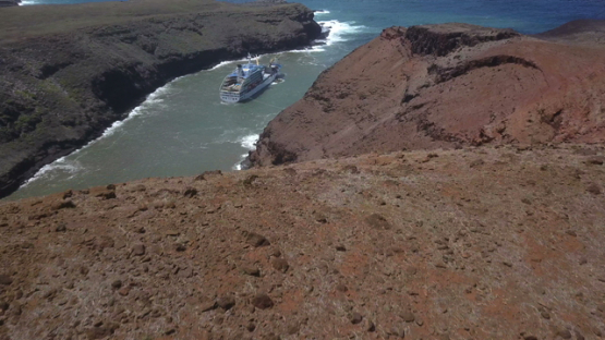 Ua Huka, aerial drone video, cargo anchored in the bay Vaipaee, marquesas islands, Polynesia 4K UHD