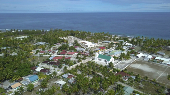 Reao, aerial drone shot above the village, Tuamotu, Polynesia, 4K UHD