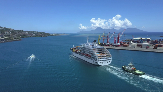 Papeete, aerial drone video of a cruise ship in the bay, Tahiti, Polynesia 4K UHD