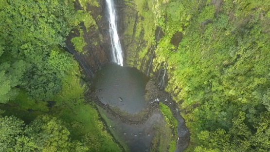 Tahiti, Aerial drone shot above a waterfall, ascending