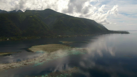 Tahiti, aerial drone view of the coast  with reflection on the lagoon, Vairao