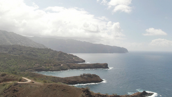 Hiva Oa aerial drone view, of Puamau and road along the  oceanic coast, Marquesas islands, 2K7