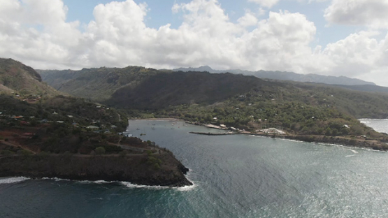 Hiva Oa, aerial drone view of Atuona and little harbour, Marquesas islands, Polynesia, 2K7