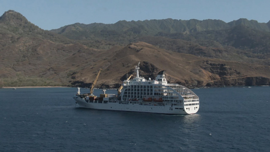 Aerial drone view, Cargo cruise ship moored in the bay, Marquesas islands, Polynesia, 2K7