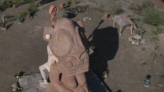 Aerial drone video of giant tiki in the bay of Taiohae, Nuku Hiva, marquesas islands, 2K7