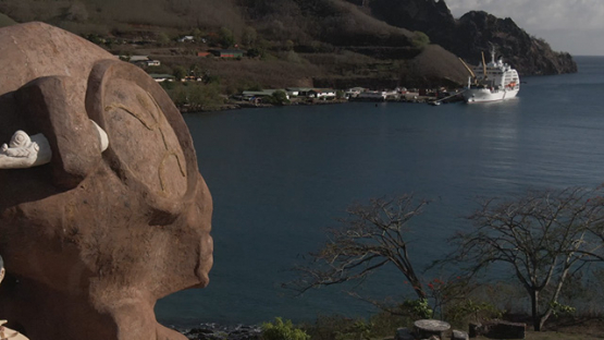 Aerial drone video of giant tiki in the bay of Taiohae, Nuku Hiva, marquesas islands, 2K7